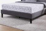Fabric upholstered bed frame and footboard detail of Aven bed set