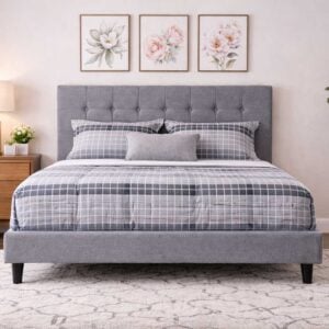 Benon Bed Set by Renome with grey upholstered frame and tufted headboard in a modern bedroom setting