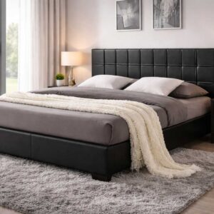 Black upholstered bed with square tufted headboard styled in a modern bedroom