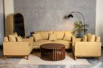 Dravellea sofa set with warm beige upholstery and straight wooden base