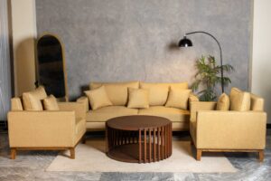 Dravellea sofa set with warm beige upholstery and straight wooden base