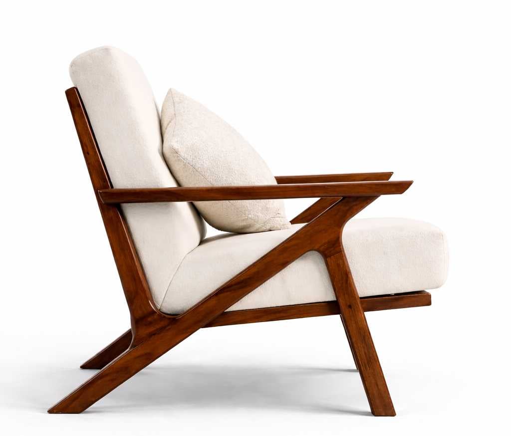 Side profile of Caldera sofa chair showing angled wooden frame