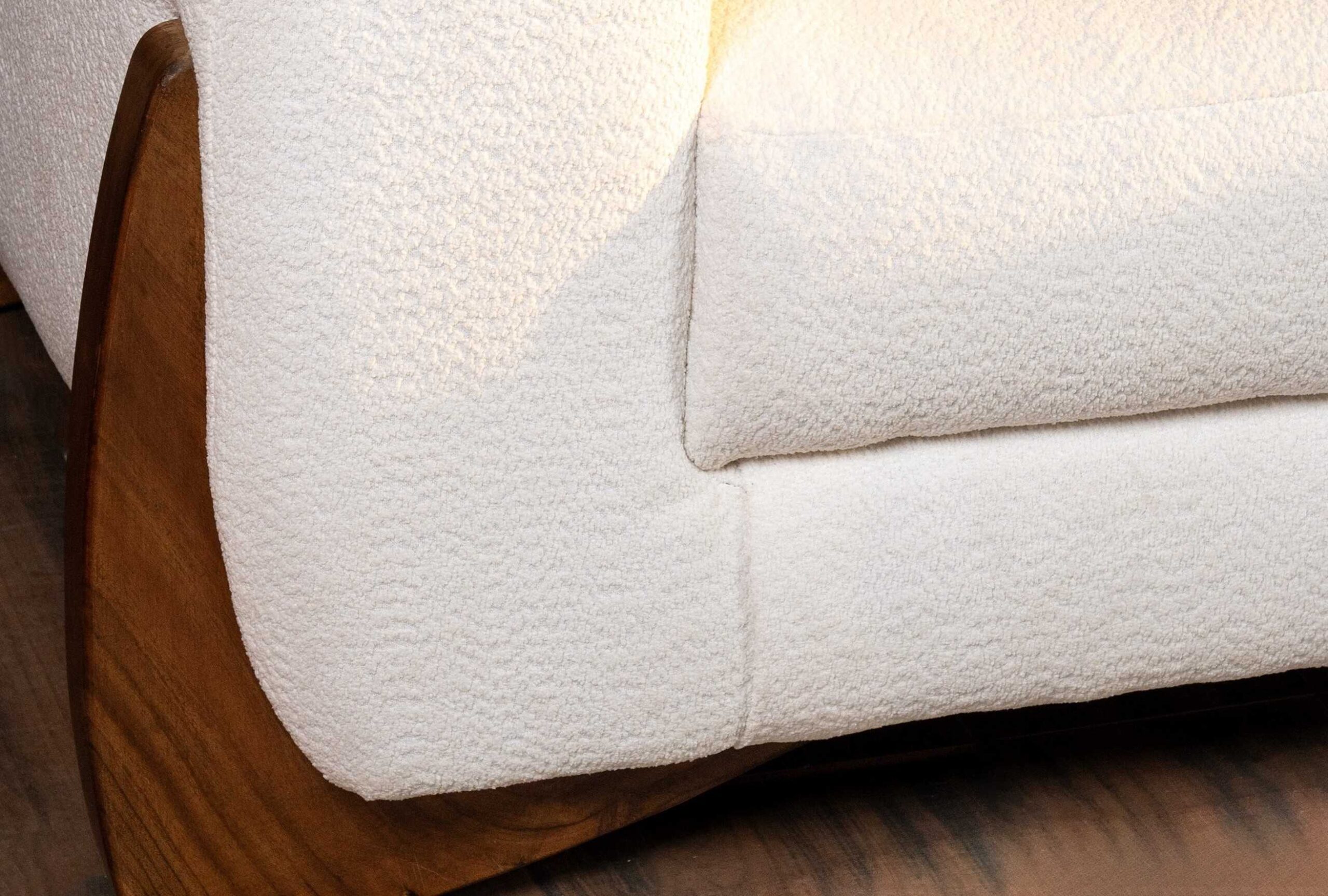 Close-up of Velmont sofa set upholstery with solid wood side frame detail