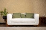 Velmont sofa set with upholstered curved arms and solid wood base design
