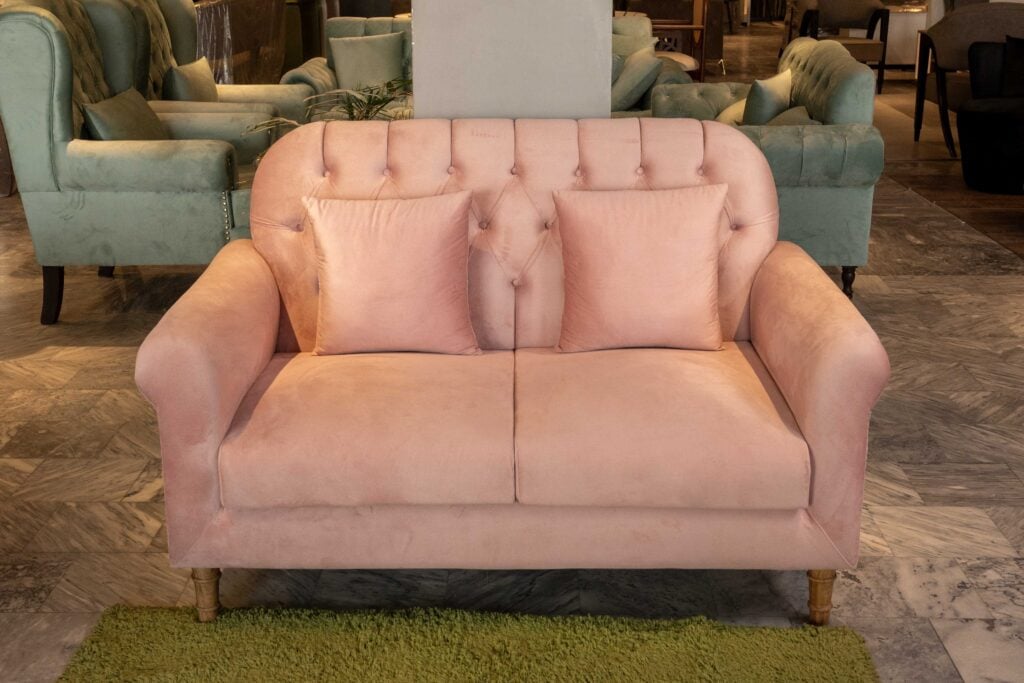 Veltrano sofa set with blush pink upholstery and tufted backrest design