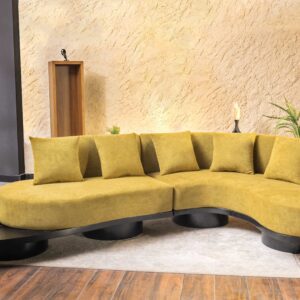 Caldris L shape curved sofa in mustard fabric with low seating and modern rounded base design in living room setting
