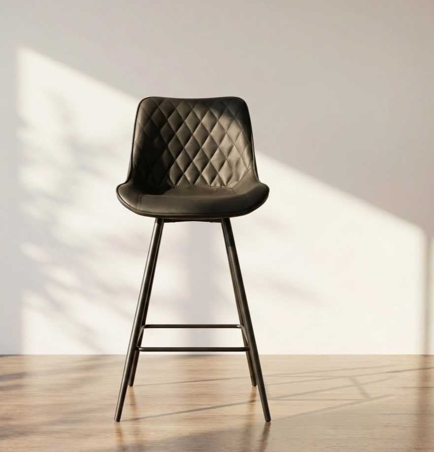 Zenith Black leather stool with diamond quilted pattern and metal kegs by renome