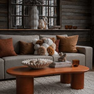 Solid wood center table with a bold sculptural design and massive cylindrical legs for modern lounges by Renome