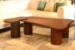 Transform your lounge with the Zen Curve coffee table by Renome. An organic wood center table featuring a unique amoeba shape and bold minimalist design
