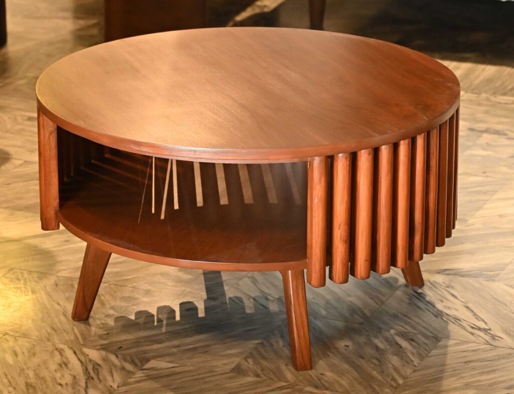 Round wooden coffee table with fluted slatted sides and tiered open storage shelf by Renome