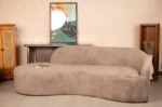 Cream-colored cloud curved bouclé sofa with plush matching cushions in a modern living room setting by Renome