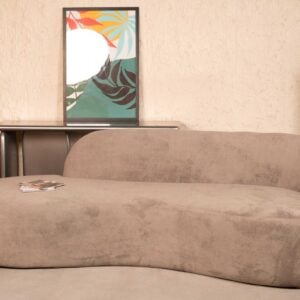 Cream-colored cloud curved bouclé sofa with plush matching cushions in a modern living room setting by Renome