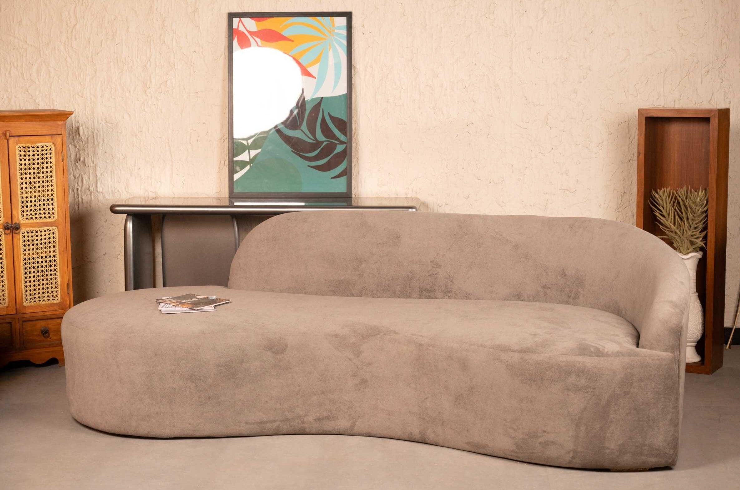 Cream-colored cloud curved bouclé sofa with plush matching cushions in a modern living room setting by Renome